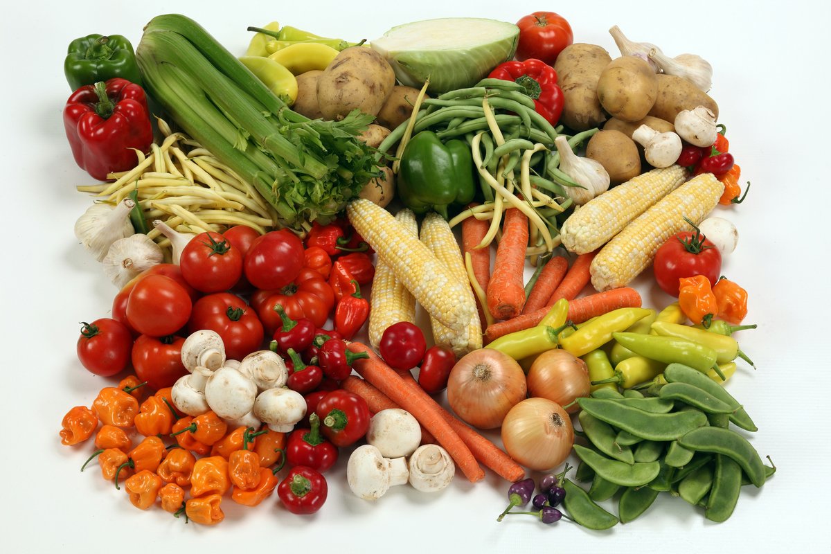 Fresh seasonal produce in a wooden crate, ready for weekly delivery